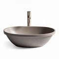 Ceramic oval sink in taupe with ribbed exterior for bathroom use 40 x 30 x 10cm